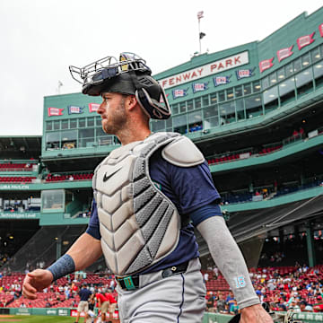 Seattle Mariners catcher Mitch Garver (18) walks to the bullpen before the start of the game against the Boston Red Sox at Fenway Park in 2024.