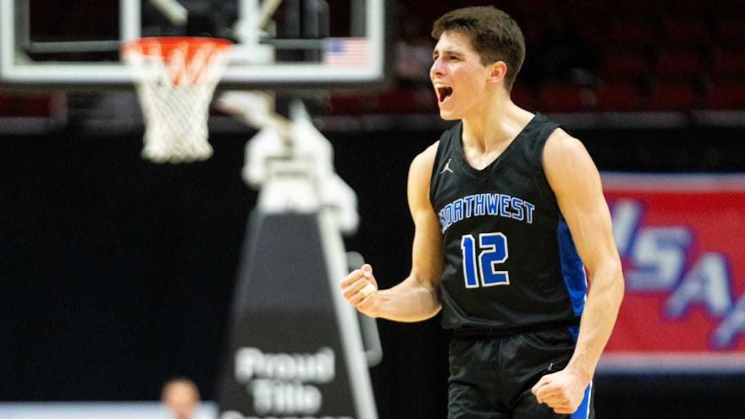 Waukee Northwest's Peyton McCollum (12) celebrates a three pointer to extend Northwest's lead over Cedar Falls in the 4A semifinal on Wednesday, March 12, 2025, at Wells Fargo Arena.