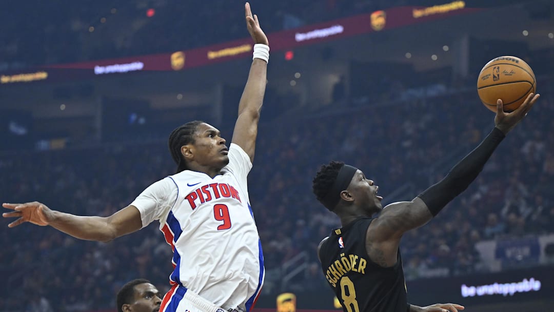 Mar 3, 2026; Cleveland, Ohio, USA; Cleveland Cavaliers guard Dennis Schroder (8) lays up a shot beside Detroit Pistons guard Ausar Thompson (9) in the third quarter at Rocket Arena. Mandatory Credit: David Richard-Imagn Images