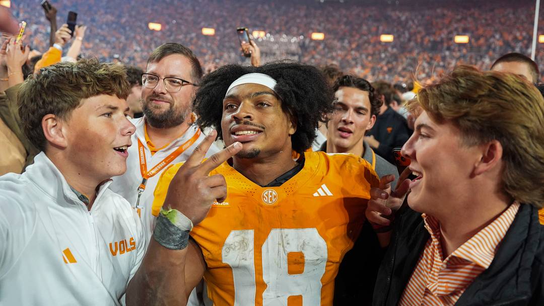 Tennessee running back DeSean Bishop (18) takes a photo with fans after a football game between Tennessee and Alabama at Neyland Stadium in Knoxville, Tenn., on Oct. 17, 2026.