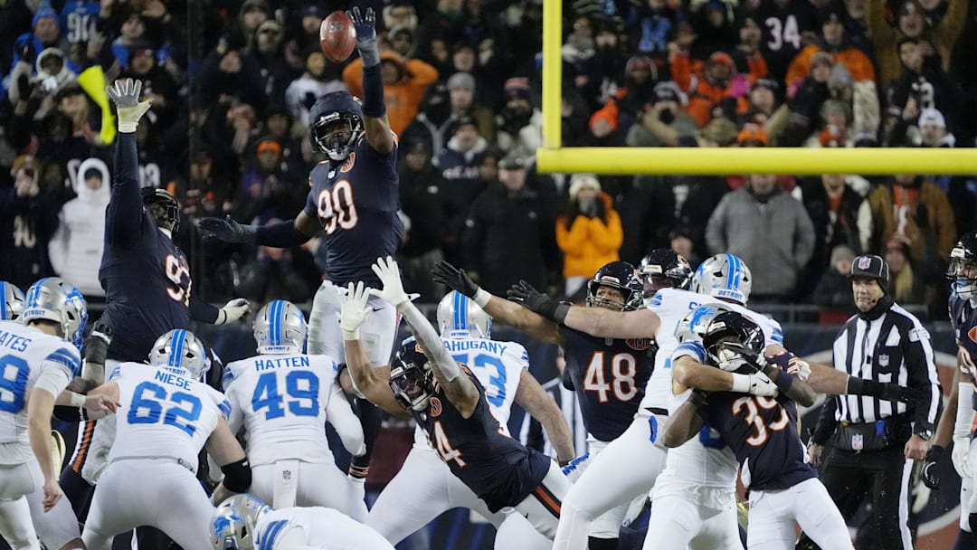 Jan 4, 2026; Chicago, Illinois, USA; Chicago Bears defensive end Dominique Robinson (90) attempts to block the game-winning field goal made by Detroit Lions place kicker Jake Bates (39) during the second half at Soldier Field. Mandatory Credit: David Banks-Imagn Images