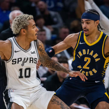 Nov 6, 2023; Indianapolis, Indiana, USA; San Antonio Spurs forward Jeremy Sochan (10) dribbles the ball while Indiana Pacers guard Andrew Nembhard (2) defends in the first half at Gainbridge Fieldhouse. Mandatory Credit: Trevor Ruszkowski-USA TODAY Sports