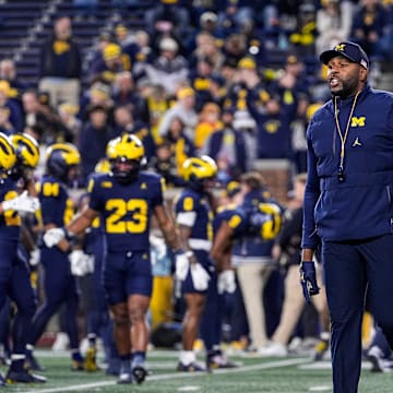 Michigan head coach Sherrone Moore watches warmup ahead of the Purdue game at Michigan Stadium in Ann Arbor on Saturday, November 1, 2025.
