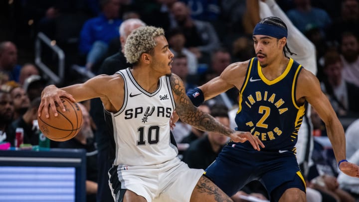 Nov 6, 2023; Indianapolis, Indiana, USA; San Antonio Spurs forward Jeremy Sochan (10) dribbles the ball while Indiana Pacers guard Andrew Nembhard (2) defends in the first half at Gainbridge Fieldhouse. Mandatory Credit: Trevor Ruszkowski-USA TODAY Sports