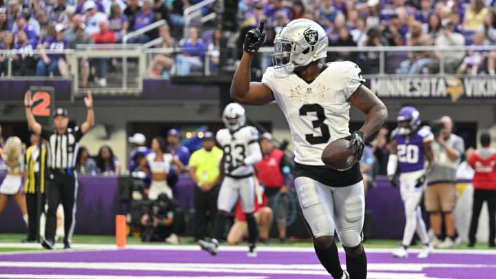 Aug 10, 2024; Minneapolis, Minnesota, USA; Las Vegas Raiders running back Zamir White (3) runs for a touchdown against the Minnesota Vikings during the third quarter at U.S. Bank Stadium. Mandatory Credit: Jeffrey Becker-USA TODAY Sports