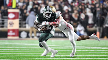 Sep 21, 2024; Chestnut Hill, Massachusetts, USA; Michigan State Spartans running back Nate Carter (5) runs the ball with Michigan State Spartans defensive back Jeremiah Hughes (3) tackling during the first half at Alumni Stadium. Mandatory Credit: Eric Canha-Imagn Images