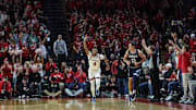 Nov 15, 2024; Piscataway, New Jersey, USA; Rutgers Scarlet Knights guard Ace Bailey (4) reacts after making a three point basket during the first half against the Monmouth Hawks at Jersey Mike's Arena. Mandatory Credit: Vincent Carchietta-Imagn Images