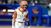 Reese Atwood (14) of Texas celebrates as she drives in two runs on a single in the sixth inning of Game 1 of the Women's College World Series championship series between the Texas Longhorns at Texas Tech Red Raiders at Devon Park in Oklahoma City, Wednesday, June 4, 2025. Texas won 2-1.