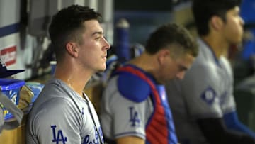 Sep 4, 2024; Anaheim, California, USA;  Los Angeles Dodgers starting pitcher Bobby Miller (28) sits in the dugout during the fifth inning against the Los Angeles Angels at Angel Stadium. Mandatory Credit: Jayne Kamin-Oncea-Imagn Images