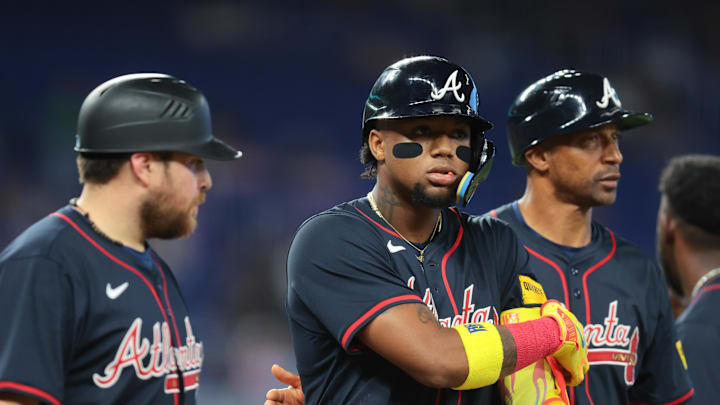 Aug 27, 2025; Miami, Florida, USA; Atlanta Braves designated hitter Ronald Acuna (13) walks toward first base after a hit by pitch against the Miami Marlins during the third inning at loanDepot Park. Mandatory Credit: Sam Navarro-Imagn Images