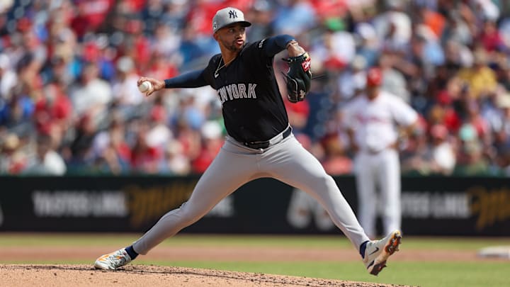 Mar 4, 2025; Clearwater, Florida, USA; New York Yankees pitcher Devin Williams (38) throws a pitch against the Philadelphia Phillies in the fourth inning during spring training at BayCare Ballpark.