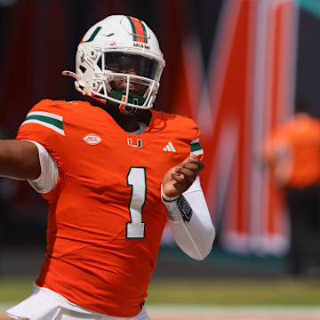 Sep 14, 2024; Miami Gardens, Florida, USA; Miami Hurricanes quarterback Cam Ward (1) throws the football before the game against the Ball State Cardinals at Hard Rock Stadium. Mandatory Credit: Sam Navarro-Imagn Images