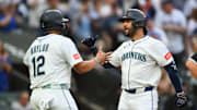 Aug 5, 2025; Seattle, Washington, USA; Seattle Mariners first baseman Josh Naylor (12) and third baseman Eugenio Suarez (28) celebrate after Suarez hit a 2-run home run against the Chicago White Sox during the fourth inning at T-Mobile Park. Mandatory Credit: Steven Bisig-Imagn Images