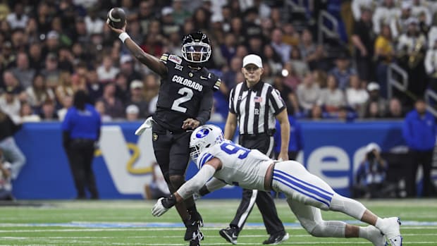 Dec 28, 2024; San Antonio, TX, USA; Colorado Buffaloes quarterback Shedeur Sanders (2) attempts a pass as Brigham Young Couga