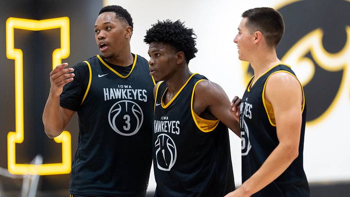 From left, Iowa’s Cam Manyawu, Ty’Reek Coleman and Peyton McCollum huddle during a summer basketball practice July 8, 2026 at Carver-Hawkeye Arena in Iowa City, Iowa.