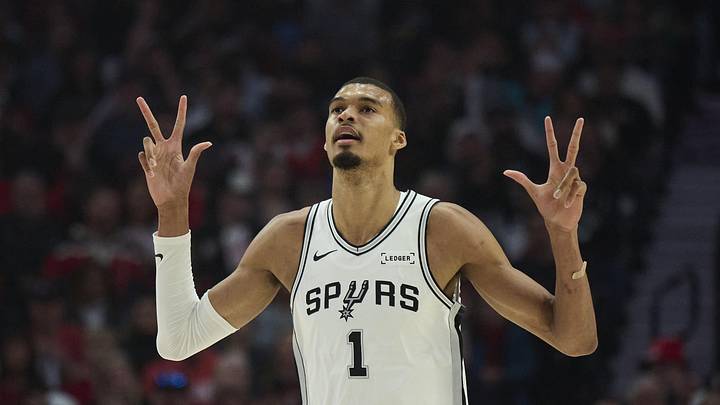 Apr 26, 2026; Portland, Oregon, USA; San Antonio Spurs forward Victor Wembanyama (1) celebrates a three point basket by guard De'aaron Fox (4) during the first half of game four of the first round of the 2026 NBA Playoffs against the Portland Trail Blazers at Moda Center. Mandatory Credit: Troy Wayrynen-Imagn Images