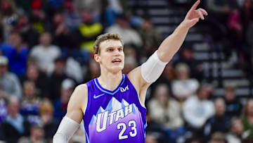 Nov 23, 2024; Salt Lake City, Utah, USA; Utah Jazz forward/center Lauri Markkanen (23) makes a call against the New York Knicks during the second half at the Delta Center. Mandatory Credit: Christopher Creveling-Imagn Images