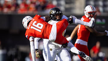 Oct 19, 2024; Tucson, Arizona, USA; Arizona Wildcats wide receiver Chris Hunter (16) is tackled by Colorado Buffaloes cornerback Colton Hood (3) at Arizona Stadium. Mandatory Credit: Mark J. Rebilas-Imagn Images