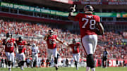Nov 30, 2025; Tampa, Florida, USA; Tampa Bay Buccaneers offensive tackle Tristan Wirfs (78) celebrates with teammates after scoring a touchdown during the first half against the Arizona Cardinals at Raymond James Stadium. Mandatory Credit: Nathan Ray Seebeck-Imagn Images