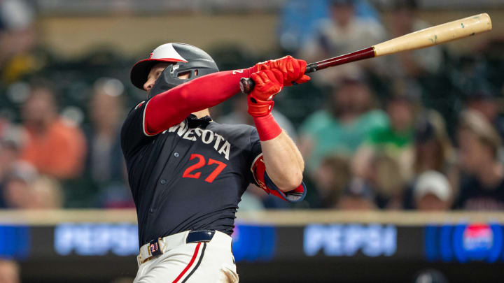 Jul 22, 2024; Minneapolis, Minnesota, USA; Minnesota Twins catcher Ryan Jeffers (27) hits a single against the Philadelphia Phillies in the eighth inning at Target Field. Mandatory Credit: Jesse Johnson-USA TODAY Sports