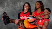 Washington Mystics' Sonia Citron, Brittney Sykes, and Kiki Iriafen take a photo before the 2025 WNBA All-Star Game 