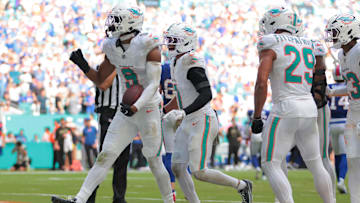 Nov 9, 2025; Miami Gardens, Florida, USA; Miami Dolphins safety Ifeatu Melifonwu (9) celebrates with safety Dante Trader Jr. (11) and safety Minkah Fitzpatrick (29) after an interception against the Buffalo Bills during the second half at Hard Rock Stadium. 