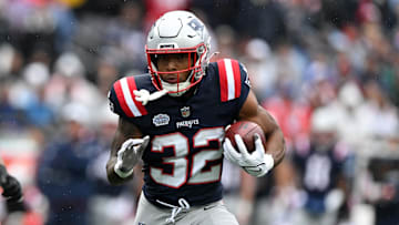 Sep 7, 2025; Foxborough, Massachusetts, USA; New England Patriots running back TreVeyon Henderson (32) rushes the ball against the Las Vegas Raiders in the first half at Gillette Stadium. Mandatory Credit: Brian Fluharty-Imagn Images