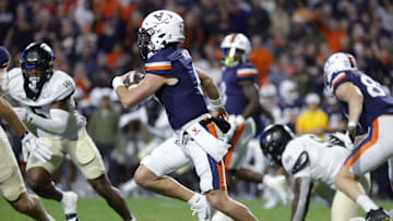 Nov 8, 2025; Charlottesville, Virginia, USA; Virginia Cavaliers quarterback Chandler Morris (4) runs with the ball and is injured on the play during the first half against the Wake Forest Demon Deacons at Scott Stadium. Mandatory Credit: Amber Searls-Imagn Images