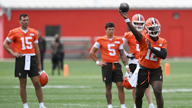 Jun 10, 2025; Berea, OH, USA; Cleveland Browns quarterback Shedeur Sanders (12) throws a pass as quarterback Joe Flacco (15)