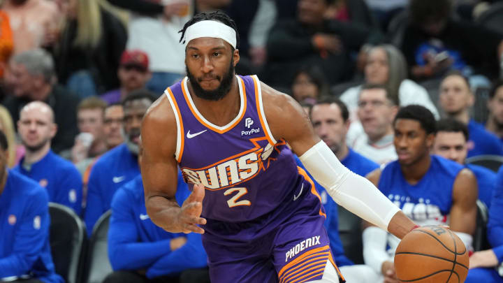 Feb 14, 2024; Phoenix, Arizona, USA; Phoenix Suns forward Josh Okogie (2) dribbles against the Detroit Pistons during the first half at Footprint Center. Mandatory Credit: Joe Camporeale-USA TODAY Sports