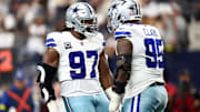 Dallas Cowboys defensive tackles Osa Odighizuwa and Kenny Clark after a play against the New York Giants.