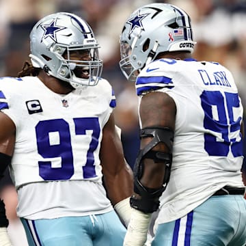 Dallas Cowboys DT Osa Odighizuwa celebrates with DT Kenny Clark after a play against the New York Giants.