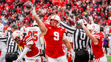 Nov 11, 2023; Lincoln, Nebraska, USA; Nebraska Cornhuskers defensive lineman Ty Robinson (9), linebacker Luke Reimer (4), and defensive back Isaac Gifford (2) celebrate after recovering a fumble against the Maryland Terrapins during the fourth quarter at Memorial Stadium.