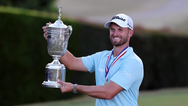 Jun 18, 2023; Los Angeles, California, USA; Wyndham Clark celebrates with the championship trophy after winning the U.S. Open