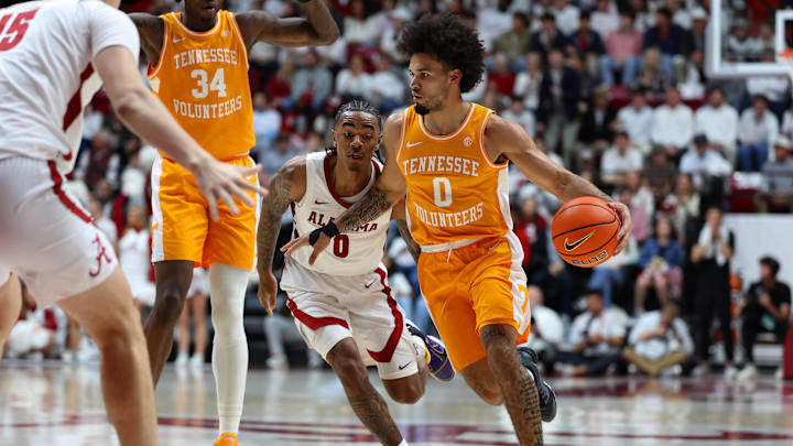 Jan 24, 2026; Tuscaloosa, Alabama, USA; Tennessee Volunteers guard Ja'Kobi Gillespie (0) dribbles past Alabama Crimson Tide guard Labaron Philon (0) during the first half at Coleman Coliseum. Mandatory Credit: David Leong-Imagn Images