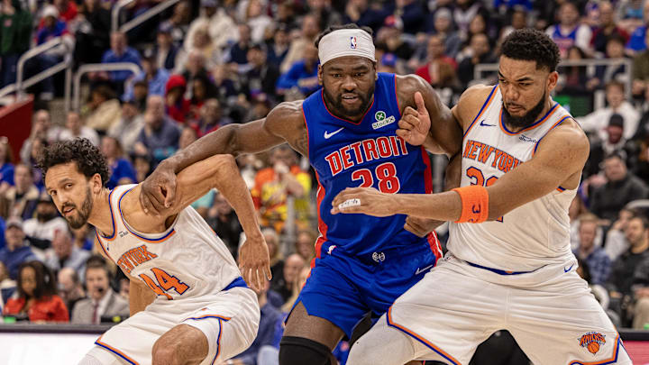 Apr 10, 2025; Detroit, Michigan, USA; Detroit Pistons center Isaiah Stewart (28) battles for position New York Knicks forward Precious Achiuwa (5) and guard Landry Shamet (44) during the second half at Little Caesars Arena. Mandatory Credit: David Reginek-Imagn Images