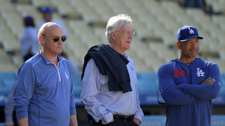 Los Angeles Dodgers president Stan Kasten chairman and controlling owner Mark Walter and manager Dave Roberts.