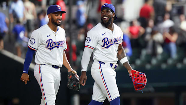 Texas Rangers outfielder Adolis García, right, celebrates a 2-0 win over the Toronto Blue Jays with Marcus Semien.