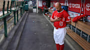 Los Angeles Angels first baseman Albert Pujols in the dugout during the national anthem before the start of a game against the Texas Rangers at Angel Stadium of Anaheim on Apr 5, 2019.