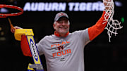 Auburn Tigers head coach Bruce Pearl cuts down the net after winning the South Regional final of the 2025 NCAA tournament against the Michigan State Spartans