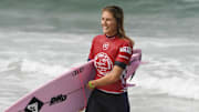 Aug 1, 2019; Huntington Beach, CA, USA; Stephanie Gilmore, of Australia, comes out of the water after completing competition during Round 3 of the Women s Qualifying Series of the Vans US Open of Surfing competition  at Surf Stadium. Mandatory Credit: Robert Hanashiro-Imagn Images