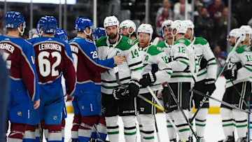 May 17, 2024; Denver, Colorado, USA; Dallas Stars left wing Jamie Benn (14) and Colorado Avalanche center Nathan MacKinnon (29) greet each other following a double overtime period in game six of the second round of the 2024 Stanley Cup Playoffs at Ball Arena. Mandatory Credit: Ron Chenoy-Imagn Images