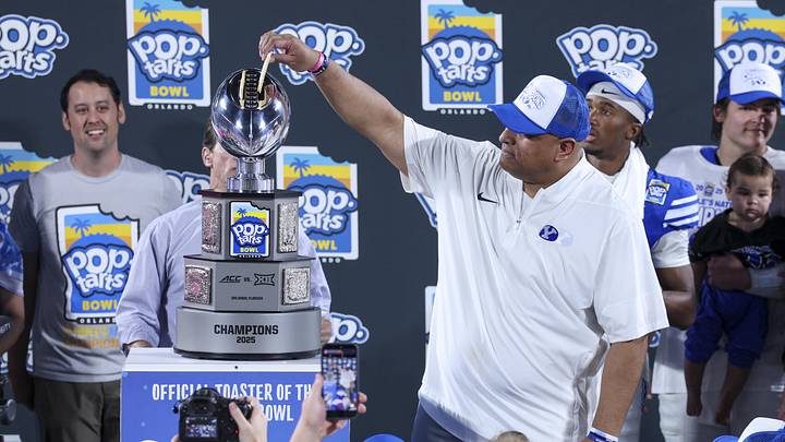 Dec 27, 2025; Orlando, FL, USA; BYU Cougars head coach Kalani Sitake celebrates after beating Georgia Tech Yellow Jackets in the Pop-Tarts Bowl at Camping World Stadium. Mandatory Credit: Nathan Ray Seebeck-Imagn Images
