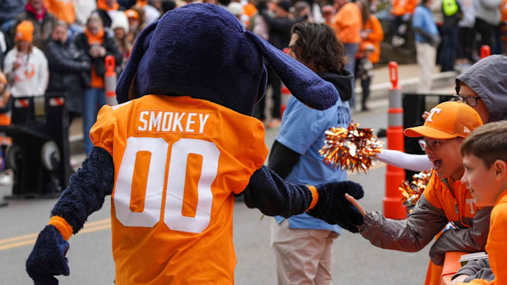 Nov 23, 2024; Knoxville, Tennessee, USA; Rivera Williams, 11, high-fives Tennessee Volunteers mascot Smokey during the Vol Walk before a game against the UTEP Miners at Neyland Stadium. Mandatory Credit: Angelina Alcantar/USA TODAY Network via Imagn Images
Nov 23, 2024; Knoxville, Tennessee, USA; Rivera Williams, 11, high-fives Tennessee Volunteers mascot Smokey during the Vol Walk before a game against the UTEP Miners at Neyland Stadium. Mandatory Credit: Angelina Alcantar/USA TODAY Network via Imagn Images