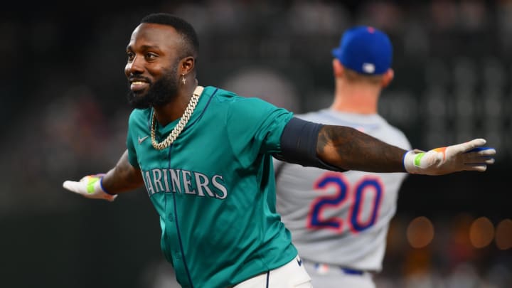 Seattle Mariners left fielder Randy Arozarena signals safe after hitting a single against the New York Mets on Aug. 10 at T-Mobile Park.