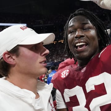 Dec 2, 2023; Atlanta, GA, USA;  Alabama Crimson Tide linebacker Deontae Lawson (32) puts on an SEC Championship hat at Mercedes-Benz Stadium. Alabama defeated Georgia 27-24 to claim the SEC Championship. Mandatory Credit: Gary Cosby Jr.-USA TODAY Sports