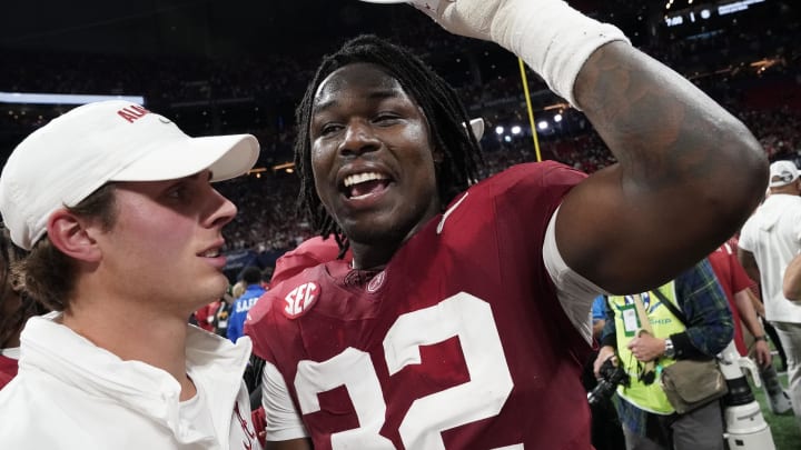 Dec 2, 2023; Atlanta, GA, USA;  Alabama Crimson Tide linebacker Deontae Lawson (32) puts on an SEC Championship hat at Mercedes-Benz Stadium. Alabama defeated Georgia 27-24 to claim the SEC Championship. Mandatory Credit: Gary Cosby Jr.-USA TODAY Sports