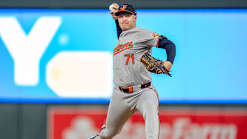 Sep 27, 2024; Minneapolis, Minnesota, USA; Baltimore Orioles pitcher Jacob Webb (71) pitches to Minnesota Twins first baseman Carlos Santana (30) in the seventh inning at Target Field. Mandatory Credit: Matt Blewett-Imagn Images