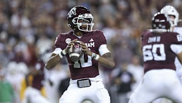 Nov 30, 2024; College Station, Texas, USA; Texas A&M Aggies quarterback Marcel Reed (10) looks for an open receiver during the second quarter against the Texas Longhorns at Kyle Field. Mandatory Credit: Troy Taormina-Imagn Images