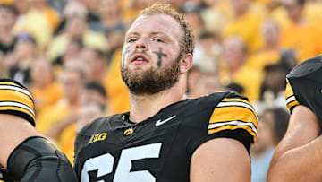 Sep 13, 2025; Iowa City, Iowa, USA; Iowa Hawkeyes offensive lineman Logan Jones (65) looks on before the game against the Massachusetts Minutemen at Kinnick Stadium. Mandatory Credit: Jeffrey Becker-Imagn Images